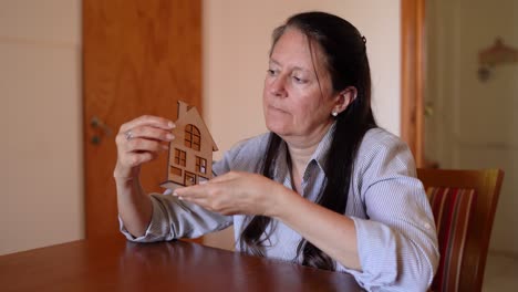 a woman contemplating the purchase of her dream home - close up