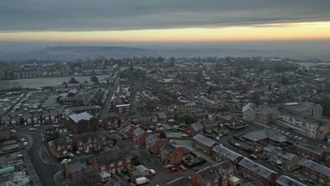 4k cinematic aerial footage, depicting harsh winter cold spell with mist and freezing temperatures