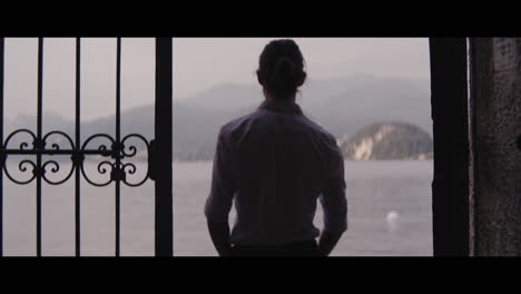 man standing at lake como