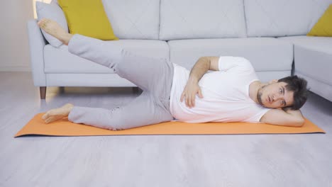 man working out his leg muscles. sports at home.