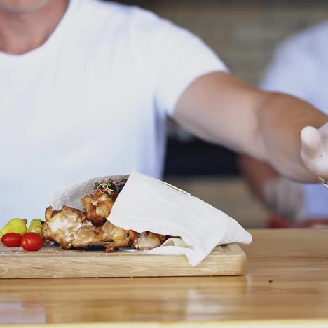 chef puts the ready meal on the table. cook putting hot delicious dish and presses the signal. dinner is ready in the restaurant. pleasant appetite.