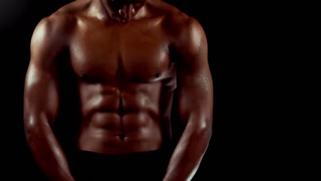 serious muscular man holding kettlebell