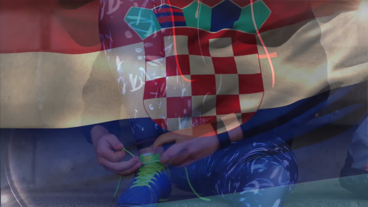 Animation of Croatian flag overlaying person sitting, wearing patterned clothing