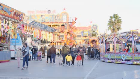 people enjoying an outdoor fair in winter
