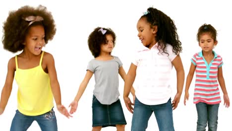 small girls all jumping together