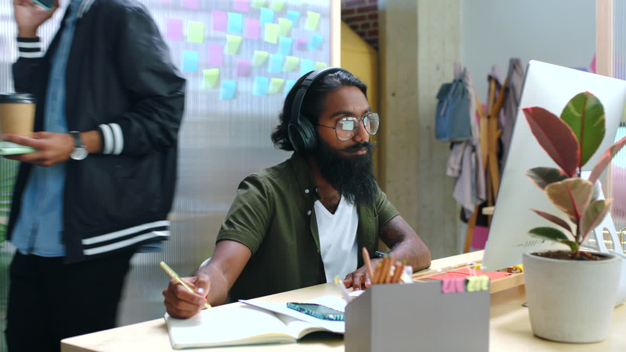 Marketing employee working in a busy office