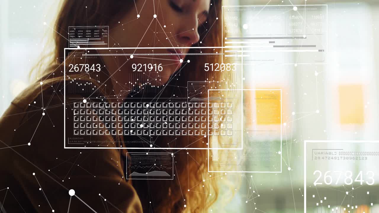 Data analyst typing on laptop and activating numeric readouts and line graphs for analyzing metrics