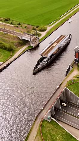 canal bridge with ship passing
