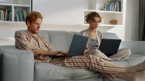 serious couple working home together closeup. managers browsing at remote office