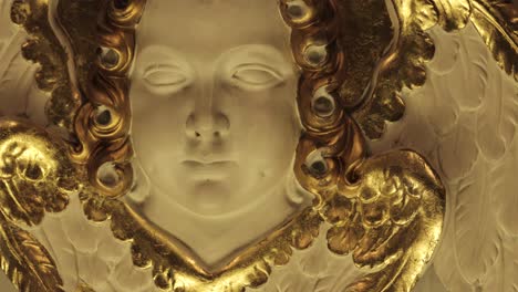 a beautiful adorned statue of an angel inside a church in central europe, captured in 4k resolution