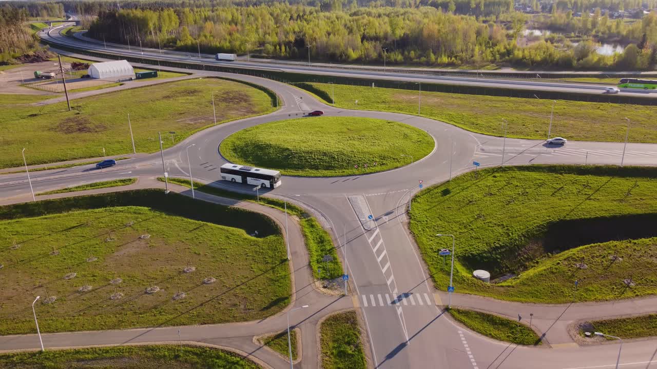 Traffic Roundabout Route Near Residential District Of Katlakalns In Latvia. Aerial Drone Shot