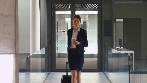 businesswoman walking with luggage