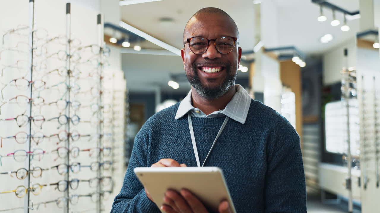 Optician Using a Tablet to Help Customers