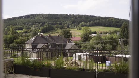 view from the window with green hills cottage moutains in summer in slow motion