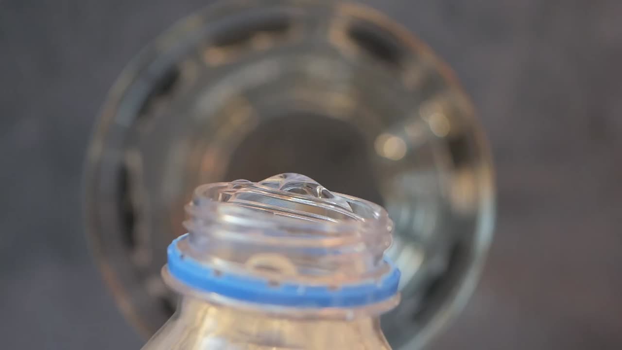 Close-up of water pouring from a bottle