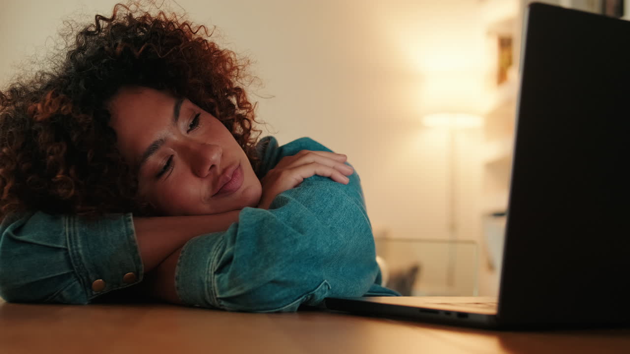 Tired Young Woman Falls Asleep While Working on Laptop