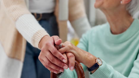 senior woman, caregiver and holding hands