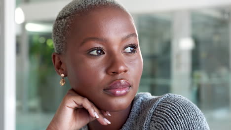professional black woman thinking while sitting
