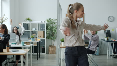 happy employees celebrating in the office