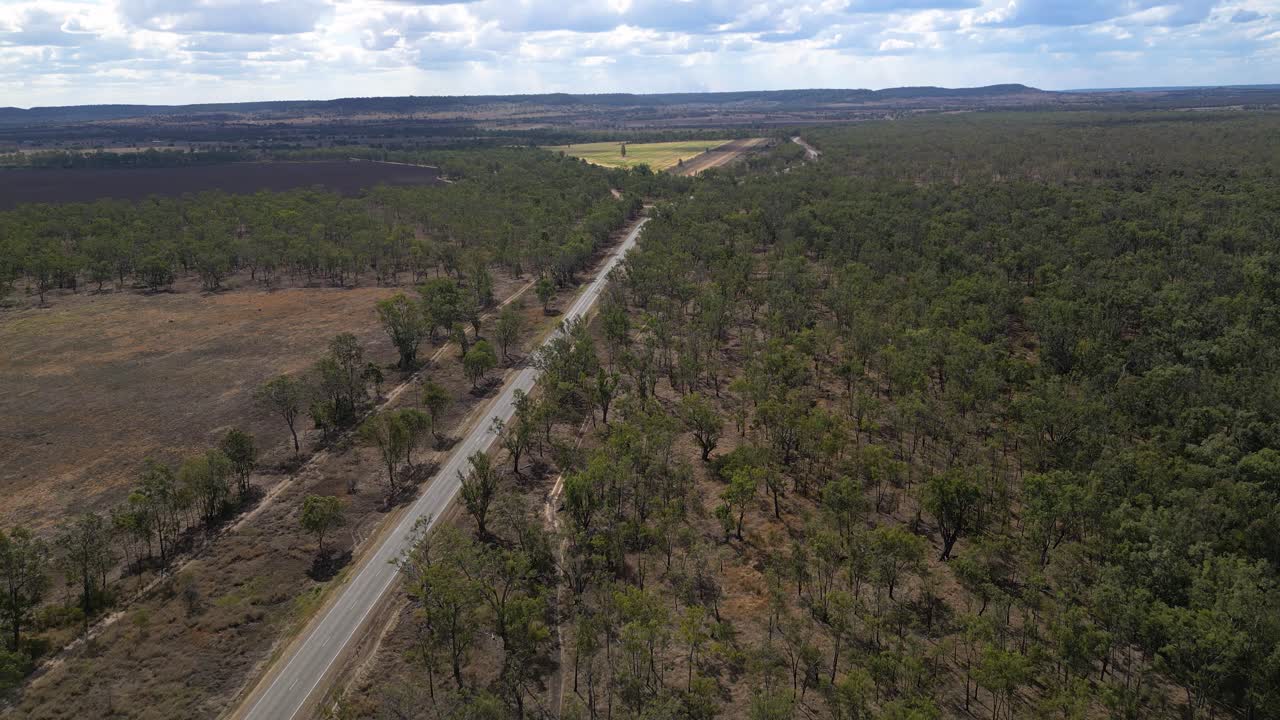 Forward moving aerial views over the town of Taroom and surrounding bushland, Central Queensland, Australia.