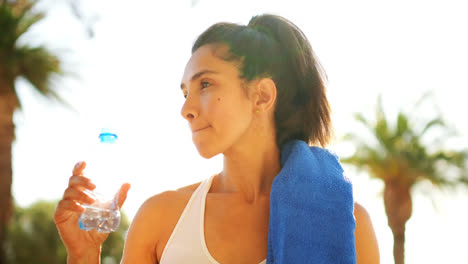 woman drinking water in balcony at home 4k