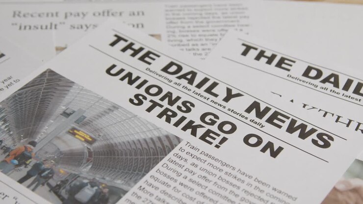 Newspaper Headlines Discussing Rail Strike Action In Trade Union Dispute