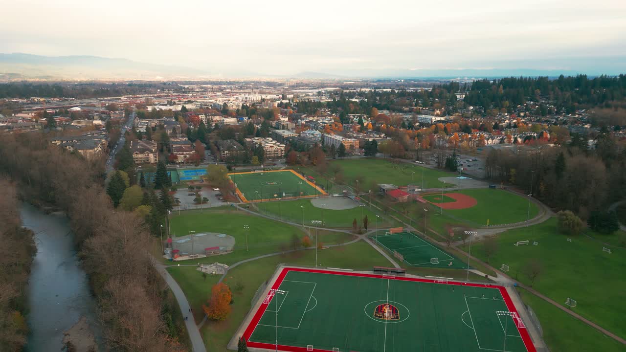 An aerial drone shot of gate's park, with sports field.