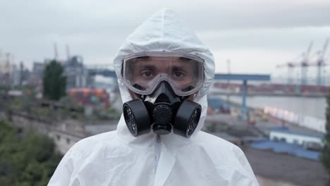 Portrait-shot-worker-put-off-the-protective-mask-and-respirator-outdoors