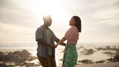 a couple enjoying a romantic sunset on the beach