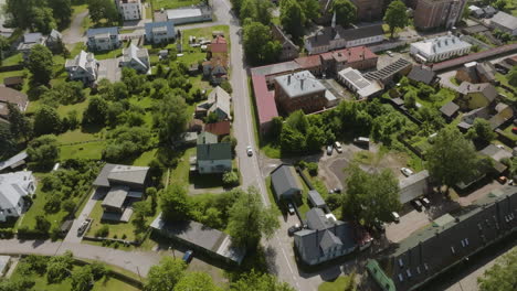 aerial view following a car driving in parnu city, sunny, summer day in estonia