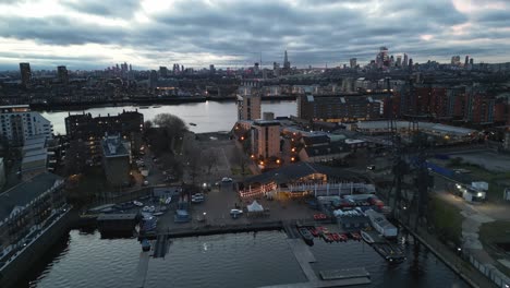 Millwall-dock-Docklands-Sailing-and-Watersports-Centre-London-UK-evening-Drone,-Aerial,-view-from-air,-birds-eye-view