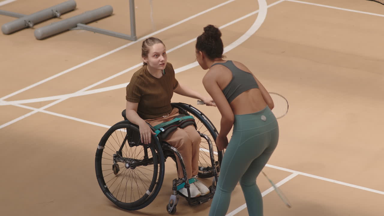Badminton Partners High-fiving after Match