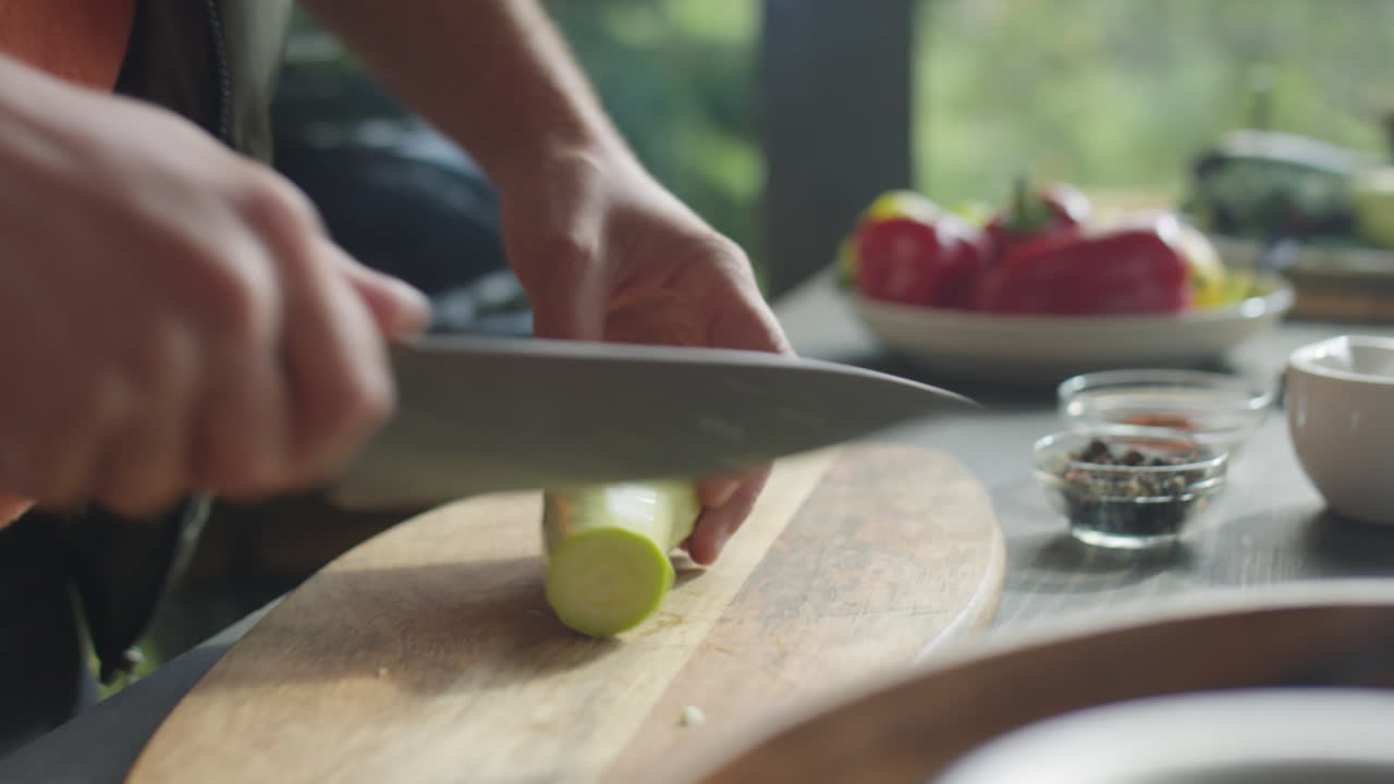 Male Hands Cutting Fresh Zucchini