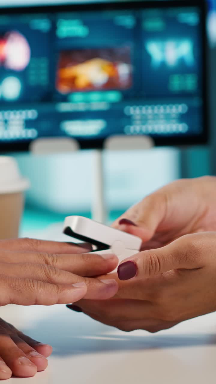 Doctor Using Pulse Oximeter to Measure Patient's Oxygen Saturation