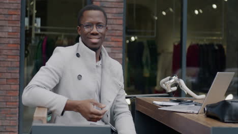 smiling businessman in a cafe