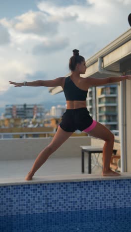 woman practicing yoga on a rooftop