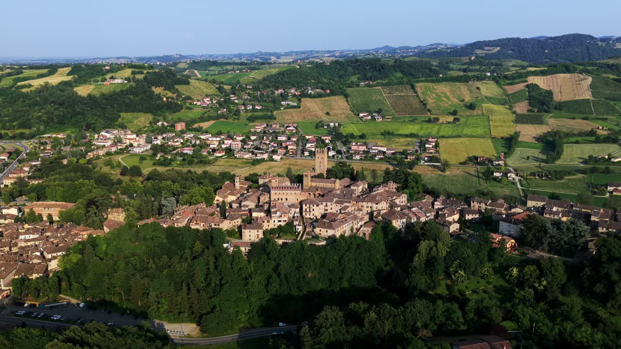 Aerial view of the medieval village of Castell'Arquato, located on top of a hill, surrounded by cultivated fields and vineyards in the Emilia Romagna region