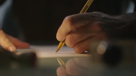 person writing at night