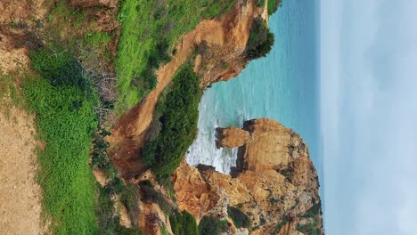 the almograve beach with black basalt rocks in alentejo coast, portugal