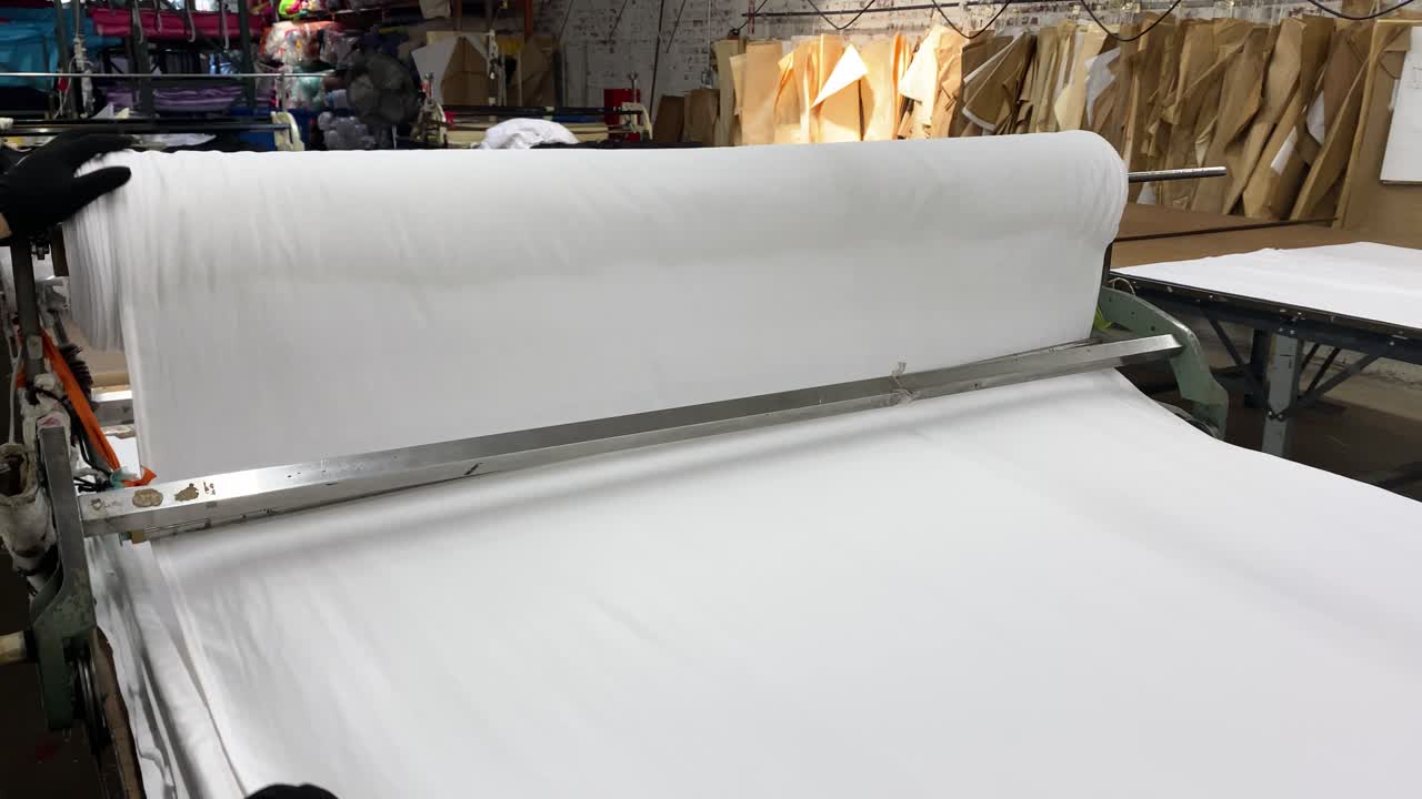 White Fabric Cutting in a Clothing Factory