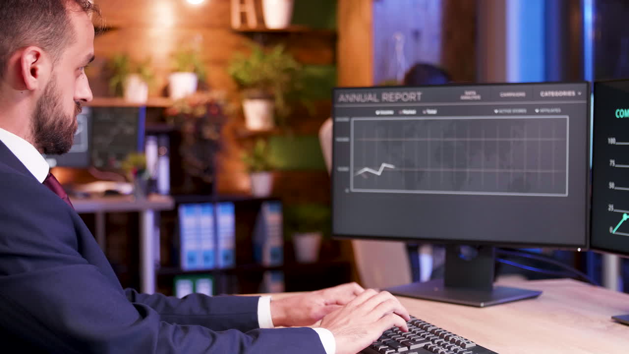 Businessman analyzing annual report on computer