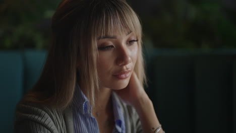 Thoughtful-concerned-chinese-japan-japanese-korean-woman-working-on-laptop-computer-looking-away-thinking-solving-problem-serious-woman-search-for-inspiration-make-decision-feel-lack-of-ideas