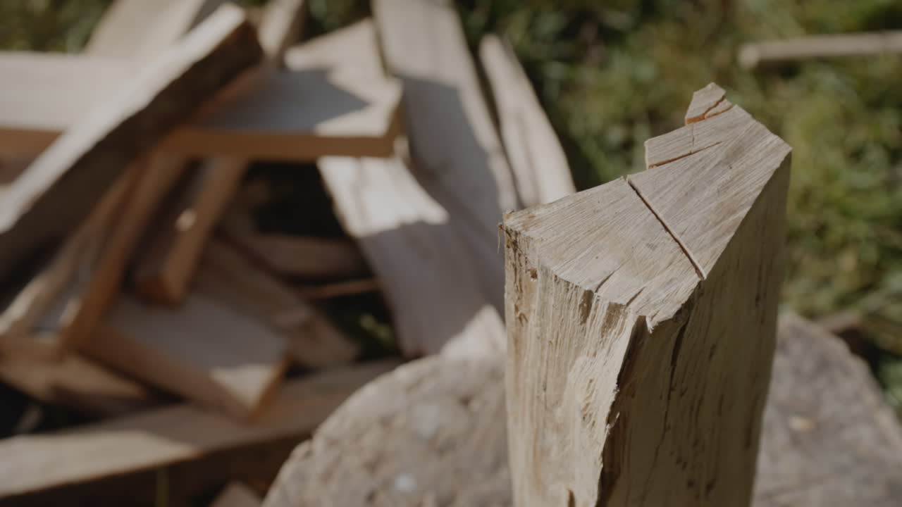 Chopping wooden log with an axe