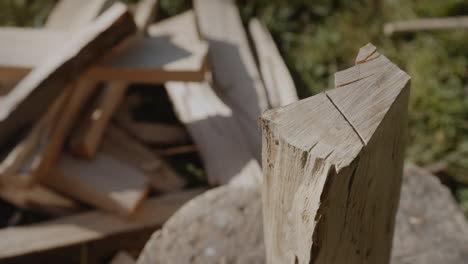 chopping wooden log with an axe