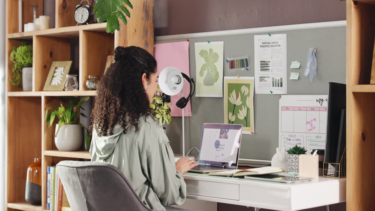 A woman working from home in her home office