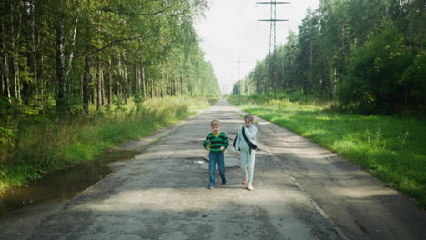 young school friends walk side by side along paved road through peaceful forest area, surrounded by tall trees and green grass, enjoying serene moment on quiet path under daylight