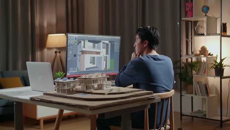 arquitecto trabajando en el diseño de la casa por la noche