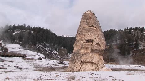 A-Medium-Shot-Of-A-Hot-Springs'-Steam-Rising-In-Winter-With-A-Limestone-Cone-In-The-Foreground