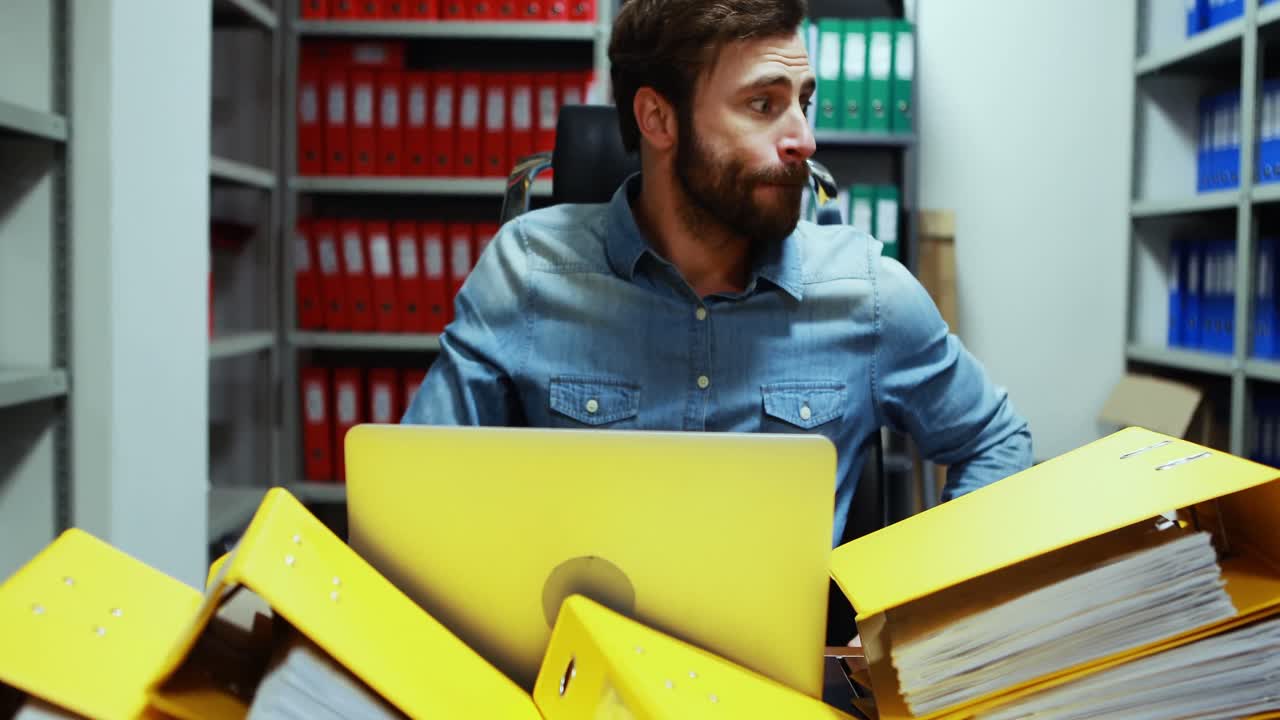 Frustrated executive working at desk