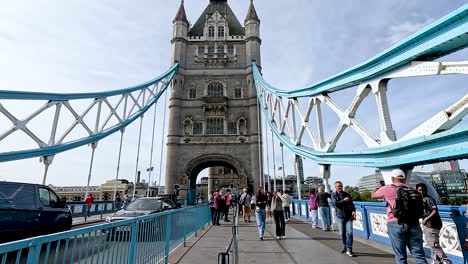 people walking on tower bridge in london